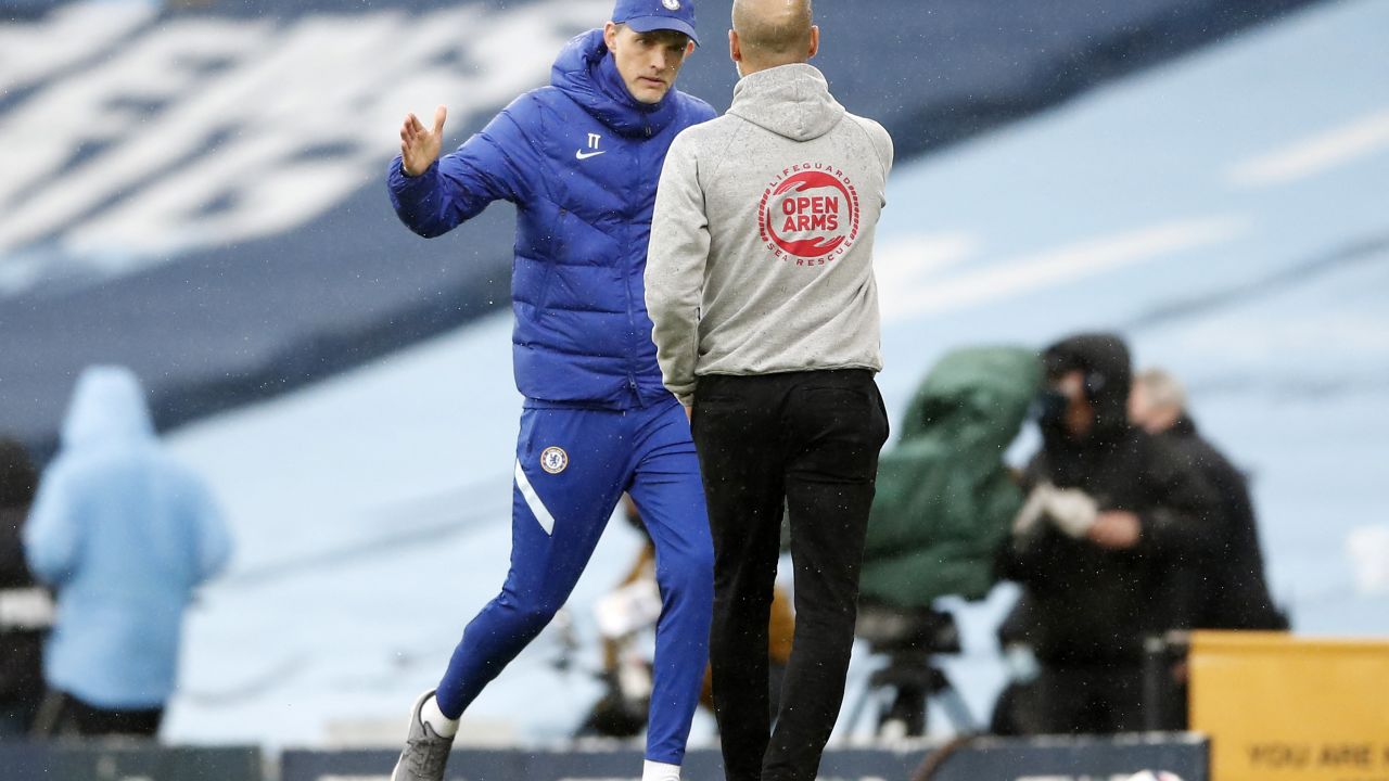 Manchester City's Spanish manager Pep Guardiola (R) shakes hands with Chelsea's German head coach Thomas Tuchel (L) after the English Premier League football match between Manchester City and Chelsea at the Etihad Stadium in Manchester, north west England, on May 8, 2021. - Chelsea won the game 2-1. - RESTRICTED TO EDITORIAL USE. No use with unauthorized audio, video, data, fixture lists, club/league logos or 'live' services. Online in-match use limited to 120 images. An additional 40 images may be used in extra time. No video emulation. Social media in-match use limited to 120 images. An additional 40 images may be used in extra time. No use in betting publications, games or single club/league/player publications. (Photo by Martin Rickett / POOL / AFP) / RESTRICTED TO EDITORIAL USE. No use with unauthorized audio, video, data, fixture lists, club/league logos or 'live' services. Online in-match use limited to 120 images. An additional 40 images may be used in extra time. No video emulation. Social media in-match use limited to 120 images. An additional 40 images may be used in extra time. No use in betting publications, games or single club/league/player publications. / RESTRICTED TO EDITORIAL USE. No use with unauthorized audio, video, data, fixture lists, club/league logos or 'live' services. Online in-match use limited to 120 images. An additional 40 images may be used in extra time. No video emulation. Social media in-match use limited to 120 images. An additional 40 images may be used in extra time. No use in betting publications, games or single club/league/player publications.
