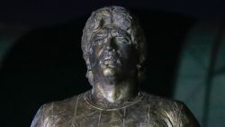 Picture of a five-metre statue of late Argentine football star Diego Armando Maradona taken after it was unveiled by members of the Argentine national football team and the president of the Argentine Football Association (AFA), Claudio Tapia, outside the Estadio Unico Madre de Ciudades stadium in Santiago del Estero, Argentina, on June 3, 2021, before the South American qualification football match for the FIFA World Cup Qatar 2022 between Argentina and Chile. (Photo by Agustin MARCARIAN / POOL / AFP)