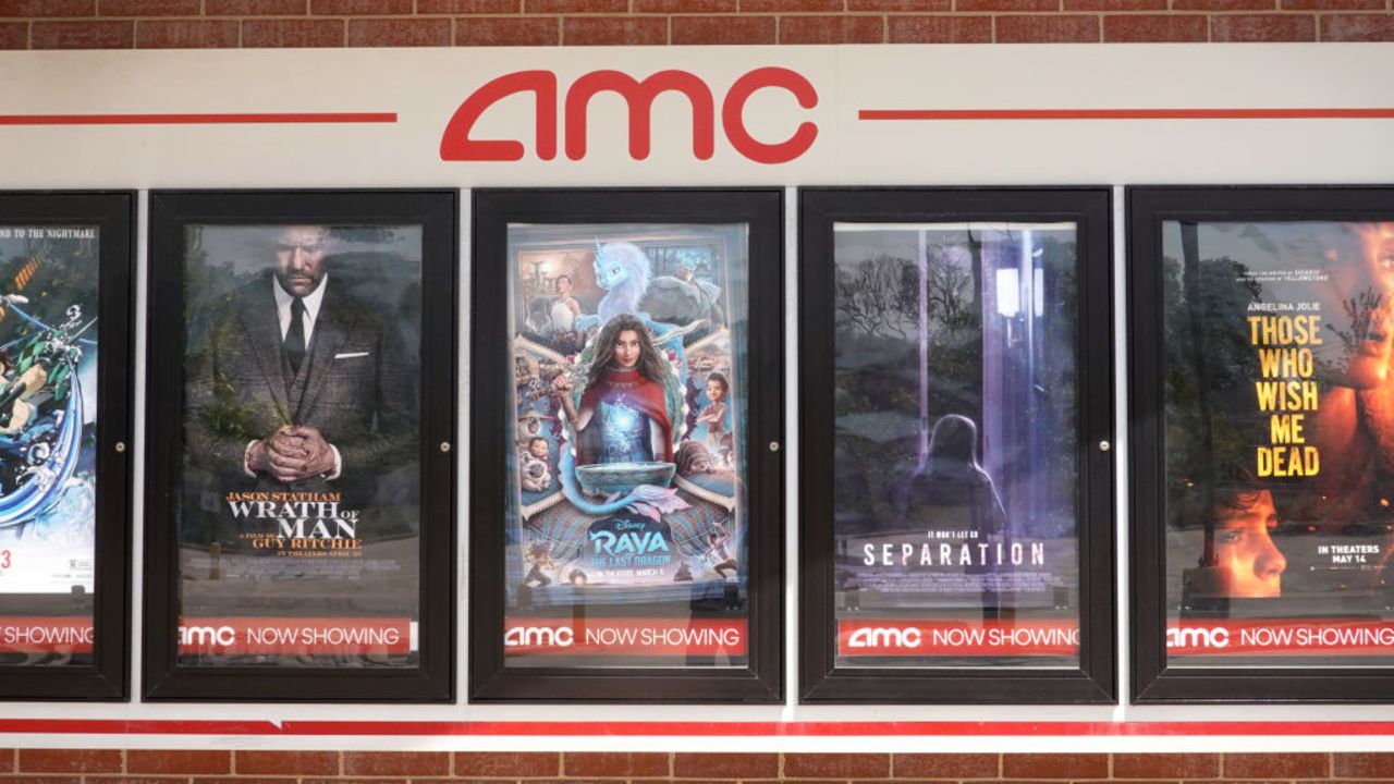 CHICAGO, ILLINOIS - JUNE 01: Movie poster of current offerings are displayed on the front of an AMC theater on June 01, 2021 in Chicago, Illinois. Mudrick Capital has agreed to purchase 8.5 million share of the theater chain for $230.5 million.