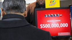 CHICAGO, IL - FEBRUARY 11:  Kirk Cook prints a Powerball lottery ticket for a customer at a 7-Eleven store on February 11, 2015 in Chicago, Illinois. Ticket sales have caused the jackpot to grow $500 million, one of the largest in the game's history.