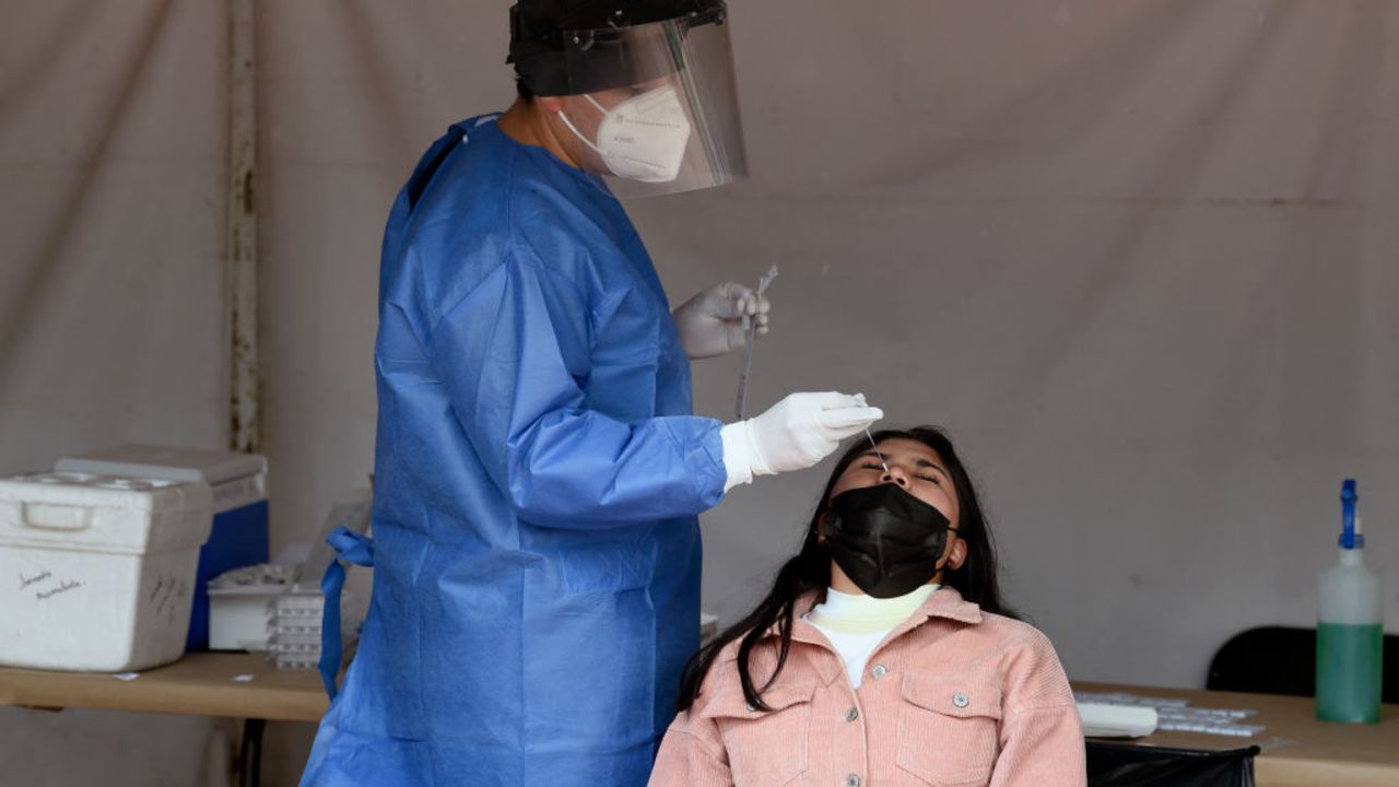 A health worker wearing protective gear collects a nasal swab for a Covid-19 test in Mexico City, on July 8, 2021. (Photo by ALFREDO ESTRELLA / AFP)