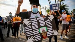 People hold signs during a rally in support of the Supreme Court's ruling in favor of the Deferred Action for Childhood Arrivals (DACA) program, in San Diego, California June 18, 2020. - Supreme Court dealt President Donald Trump's anti-immigration  efforts a fresh blow Thursday when it rejected his cancellation of a program protecting 700,000 "Dreamers," undocumented migrants brought to the United States as children. (Photo by Sandy Huffaker / AFP)