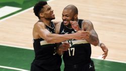 MILWAUKEE, WISCONSIN - JULY 20: Giannis Antetokounmpo #34 of the Milwaukee Bucks celebrates with teammate P.J. Tucker #17 in the final seconds before defeating the Phoenix Suns in Game Six to win the 2021 NBA Finals at Fiserv Forum on July 20, 2021 in Milwaukee, Wisconsin. NOTE TO USER: User expressly acknowledges and agrees that, by downloading and or using this photograph, User is consenting to the terms and conditions of the Getty Images License Agreement.