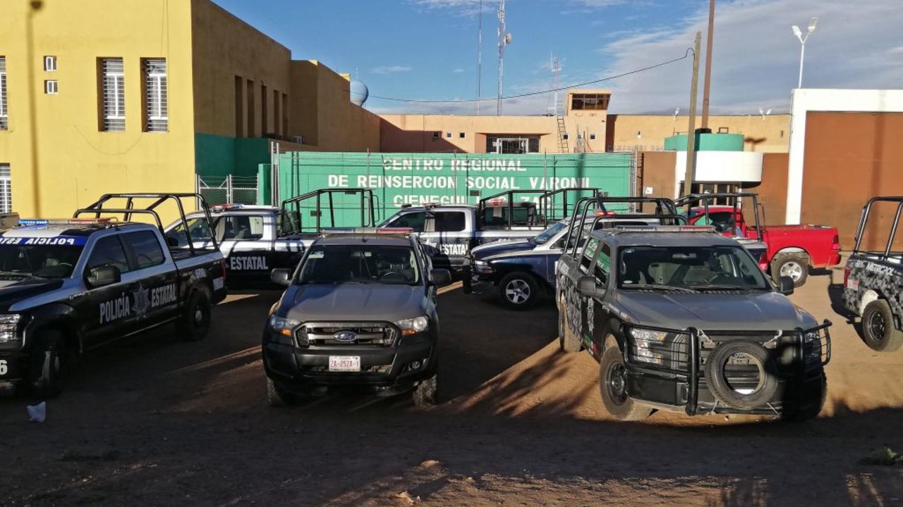 Federal Police vehicles remain outside the Regional Center for Social Reinsertion after a riot in Zacatecas, Mexico, on December 31, 2019. - A prison riot left 16 inmates dead and five wounded in the central Mexican state of Zacetecas on New Year's Eve, local authorities said Wednesday. (Photo by MICHAELL REYES / AFP)