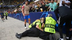 BERN, SWITZERLAND - SEPTEMBER 14: A security guard lies injured after a shot taken from Cristiano Ronaldo of Manchester United during the warm up makes contact with him during the UEFA Champions League group F match between BSC Young Boys and Manchester United at Stadion Wankdorf on September 14, 2021 in Bern, Switzerland.