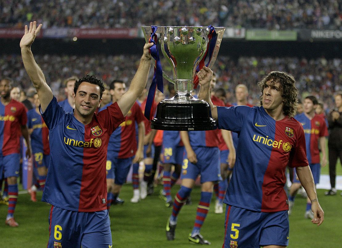 Celebrando un título el 23 de mayo de 2009 con Carles Puyol. Crédito JOSEP LAGO/AFP via Getty Images