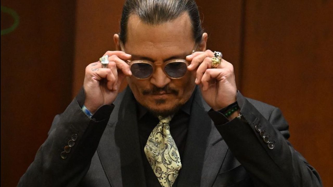 US actor Johnny Depp testifies during his defamation trial in the Fairfax County Circuit Courthouse in Fairfax, Virginia, on April 19, 2022. - Depp is suing ex-wife Amber Heard for libel after she wrote an op-ed piece in The Washington Post in 2018 referring to herself as a public figure representing domestic abuse. (Photo by JIM WATSON / POOL / AFP)