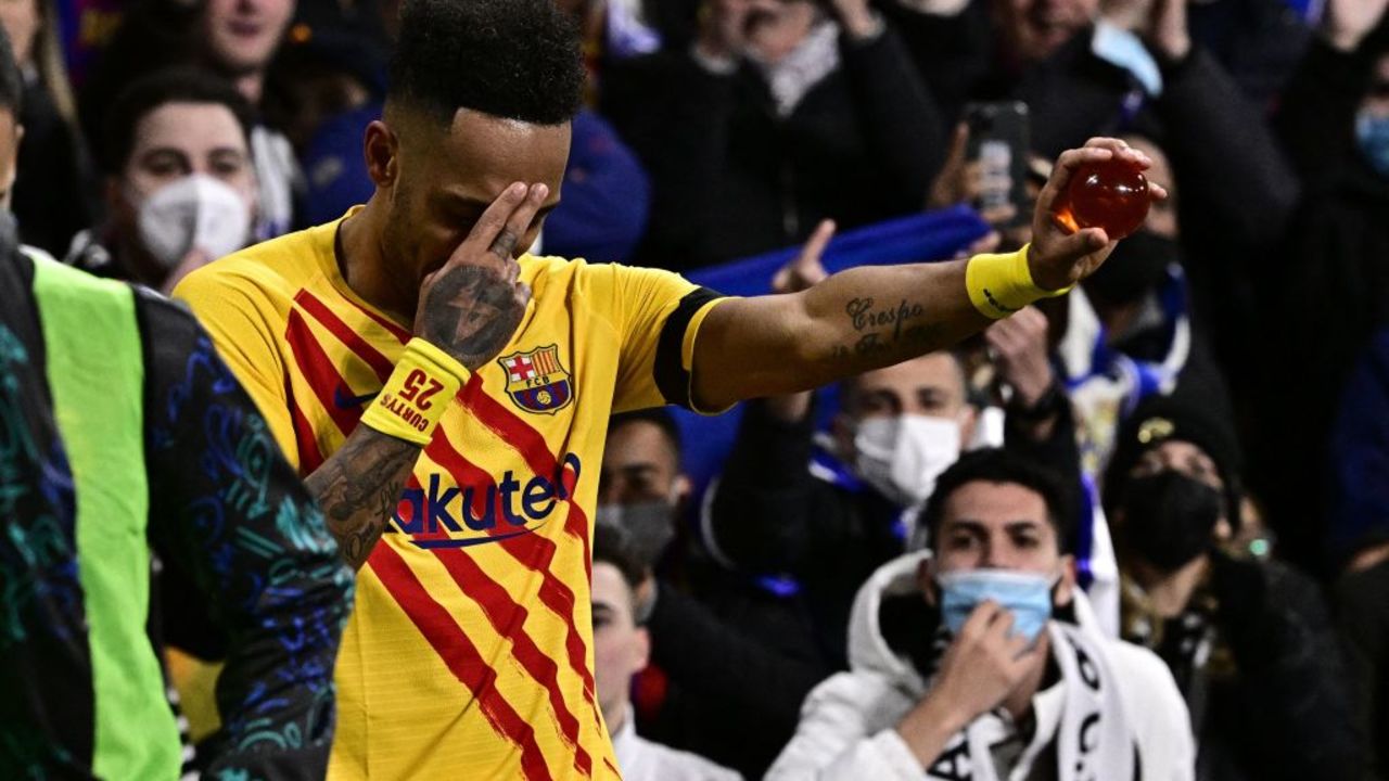 Barcelona's Gabonese midfielder Pierre-Emerick Aubameyang celebrates after scoring a goal during the Spanish League football match between Real Madrid CF and FC Barcelona at the Santiago Bernabeu stadium in Madrid on March 20, 2022. (Photo by JAVIER SORIANO / AFP)