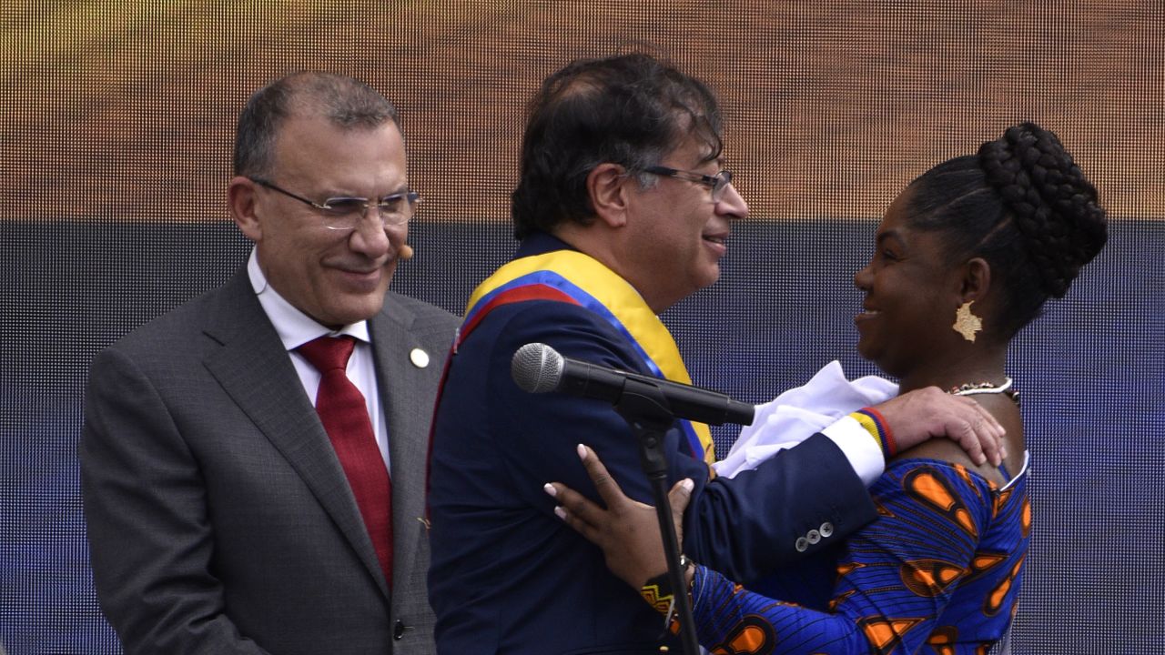 BOGOTA, COLOMBIA - AUGUST 07: President of Colombia Gustavo Petro greets his Vice President Francia Marquez as Colombia's Senate President Roy Barreras looks them during the presidential inauguration at Plaza Bolivar on August 07, 2022 in Bogota, Colombia. Leftist leader was elected president in a tight runoff against Rodolfo Hernandez on June 19.