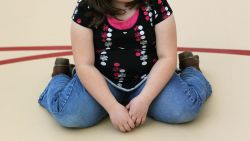 AURORA, CO - NOVEMBER 13:  A child sits on the gym floor during the Shapedown program for overweight adolescents and children on November 13, 2010 in Aurora, Colorado. The 10-week family-centered program held by the Denver area Children's Hospital teaches youth and their parents ways to lead a healthier more active lifestyle, as a longer lasting weight-loss alternative to dieting. Nationally, some 15 percent of children are overweight or obese, as are some 60 percent of adults.