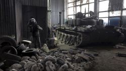 EASTERN UKRAINE - FEBRUARY 13: A captured Russian T-72B3 tank awaits repairs as a welder prepares to work on February 13, 2023 at a warehouse in eastern Ukraine. The Ukrainian crowdfunding organization Serhiy Prytula Charity Foundation funds the facility which refurbishes tanks and armored vehicles captured on the battlefield from retreating Russian forces. Such "trophy" vehicles have been crucial to resupply Ukrainian forces who often rely on older Soviet-era fleets, increasingly augmented by newer western weapons systems.