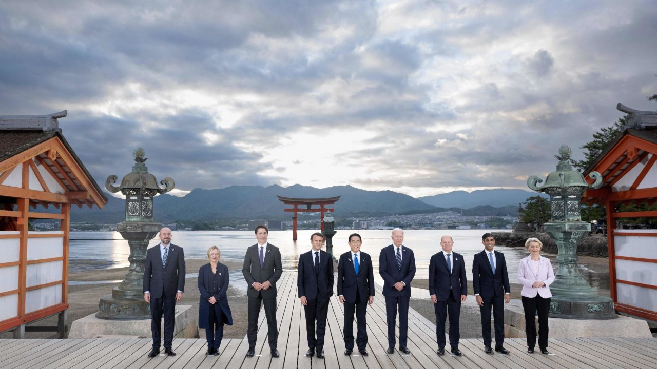 (L-R) European Council President Charles Michel, Italy's Primer Minister Giorgia Meloni, Canada's Prime Minister Justin Trudeau, France's President Emmanuel Macron, Japan's Prime Minister Fumio Kishida, US President Joe Biden, German Chancellor Olaf Scholz, Britain's Prime Minister Rishi Sunak and European Commission President Ursula von der Leyen pose for the family photo during a visit to the Itsukushima Shrine in Miyajima Island as part of the G7 Leaders' Summit, on May 19, 2023. (Photo by Jacques WITT / POOL / AFP)