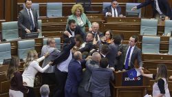 Lawmakers push each other as a brawl breaks out in Kosovo's parliament in Pristina, Kosovo, Thursday, July 13, 2023. A brawl erupted in the Kosovo parliament on Thursday after an opposition lawmaker threw water on Prime Minister Albin Kurti while he was speaking about government measures to defuse tensions with ethnic Serbs in the country's north. Kosovo opposition parties have criticized Kurti's policies in the north that have strained relations with key Western allies.