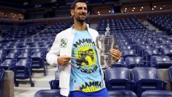 NEW YORK, NEW YORK - SEPTEMBER 10: Novak Djokovic of Serbia poses for the media with his winners trophy wearing a shirt as a tribute to the late Kobe Bryant after defeating Daniil Medvedev of Russia during their Men's Singles Final match on Day Fourteen of the 2023 US Open at the USTA Billie Jean King National Tennis Center on September 10, 2023 in the Flushing neighborhood of the Queens borough of New York City.