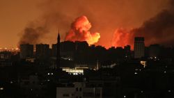 A ball of fire erupts in Gaza City after an Israeli air strike on October 12, 2023. Israel has vowed to "crush" Hamas after gunmen from the Palestinian Islamist group stormed across the border and killed 1,200 people -- the deadliest attack on the country since it was founded 75 years ago. (Photo by Mahmud Hams / AFP)