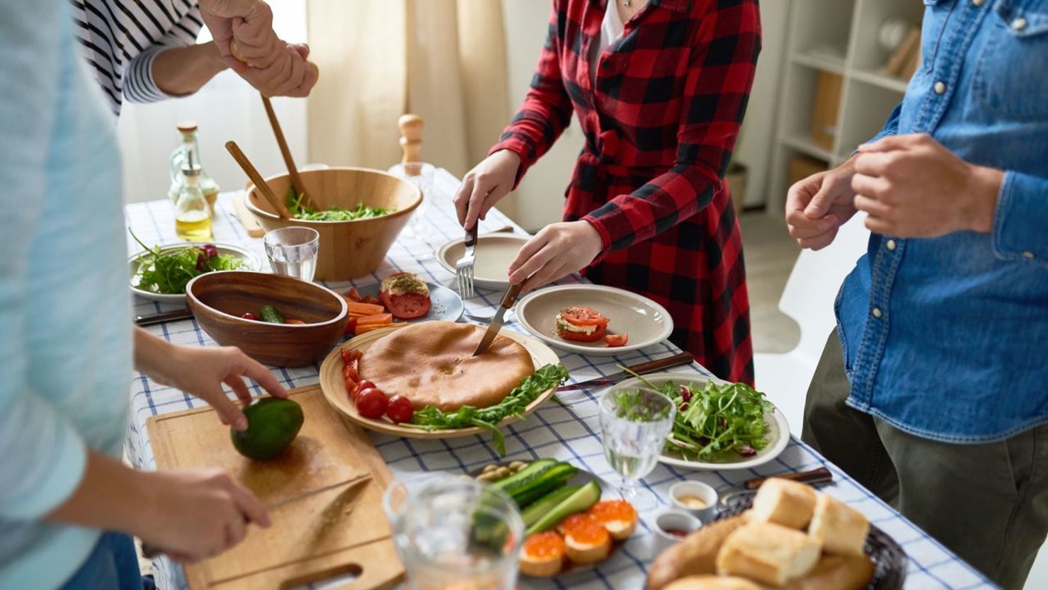 CNNE 1516252 - 221121165459-holiday-around-the-table-stock