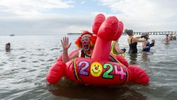 NEW YORK, NEW YORK - JANUARY 1: People participate in the 121st annual Polar Bear Plunge in Coney Island on January 1, 2024 in New York City. The New Year's Day event expects some 4,000 swimmers and 20,000 onlookers this year.