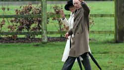 Britain's King Charles III and Britain's Queen Camilla waves as they leave after attending a service at St Mary Magdalene Church on the Sandringham Estate in eastern England on February 11, 2024. Britain's King Charles III on Saturday expressed his "heartfelt thanks" to well-wishers, in his first statement since his shock announcement that he has cancer. (Photo by JUSTIN TALLIS / AFP)