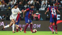 RIYADH, SAUDI ARABIA - JANUARY 14: Ilkay Gundogan of FC Barcelona passes the ball towards Jules Kounde of FC Barcelona under pressure from Jude Bellingham of Real Madrid during the Super Copa de España Final match between Real Madrid and FC Barcelona on January 14, 2024 in Riyadh, Saudi Arabia.