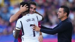 BARCELONA, SPAIN - OCTOBER 28: Ferran Torres of FC Barcelona embraces Vinicius Junior of Real Madrid during the LaLiga EA Sports match between FC Barcelona and Real Madrid CF at Estadi Olimpic Lluis Companys on October 28, 2023 in Barcelona, Spain.