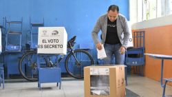 A man casts his vote at a polling station during a referendum on tougher measures against organized crime in Quito on April 21, 2024. Ecuadorans voted Sunday in a referendum on proposed tougher measures to fight gang-related crime. The once-peaceful South American country has been grappling with a shocking rise in violence that has seen two mayors killed this week. (Photo by Rodrigo BUENDIA / AFP)