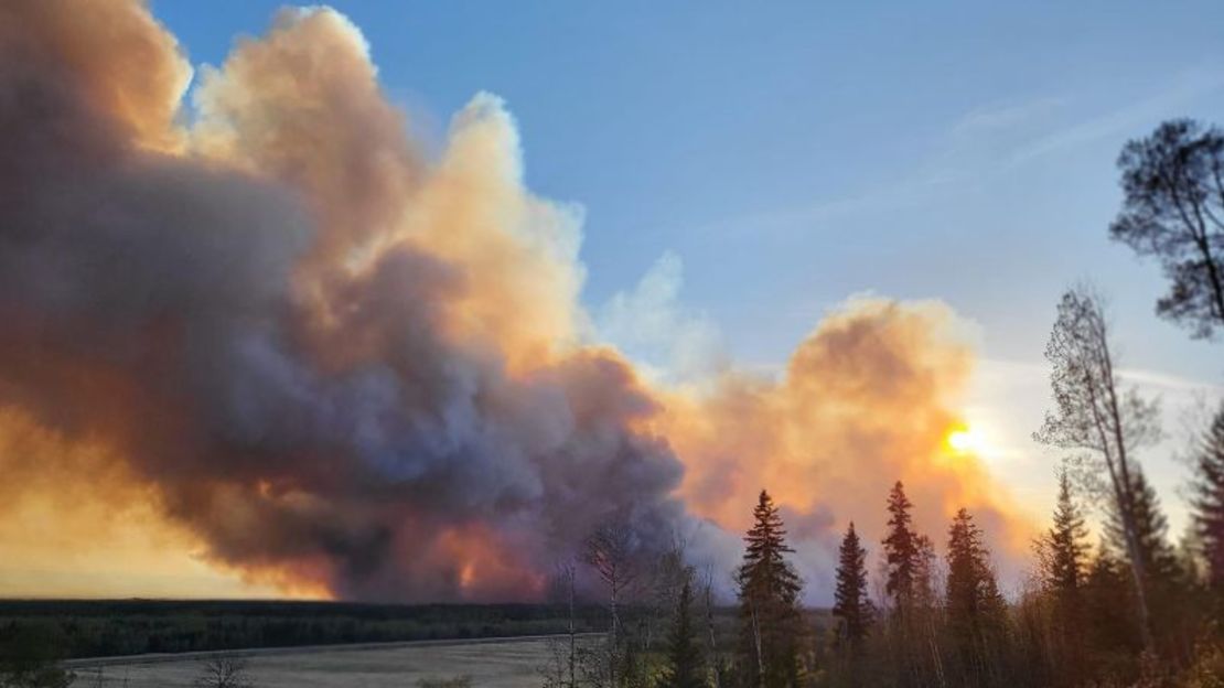 Smoke rises from a wildfire near Fort Nelson on May 14.