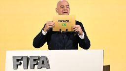 FIFA President Gianni Infantino announces Brazil as the hosts of the 2027 Women's World Cup during the 74th FIFA Congress in Bangkok on May 17, 2024. The 74th FIFA Congress is taking place in Bangkok with member associations voting on a range of issues including confirmation of the host nation or nations for the 2027 women's football World Cup. (Photo by Manan VATSYAYANA / AFP)