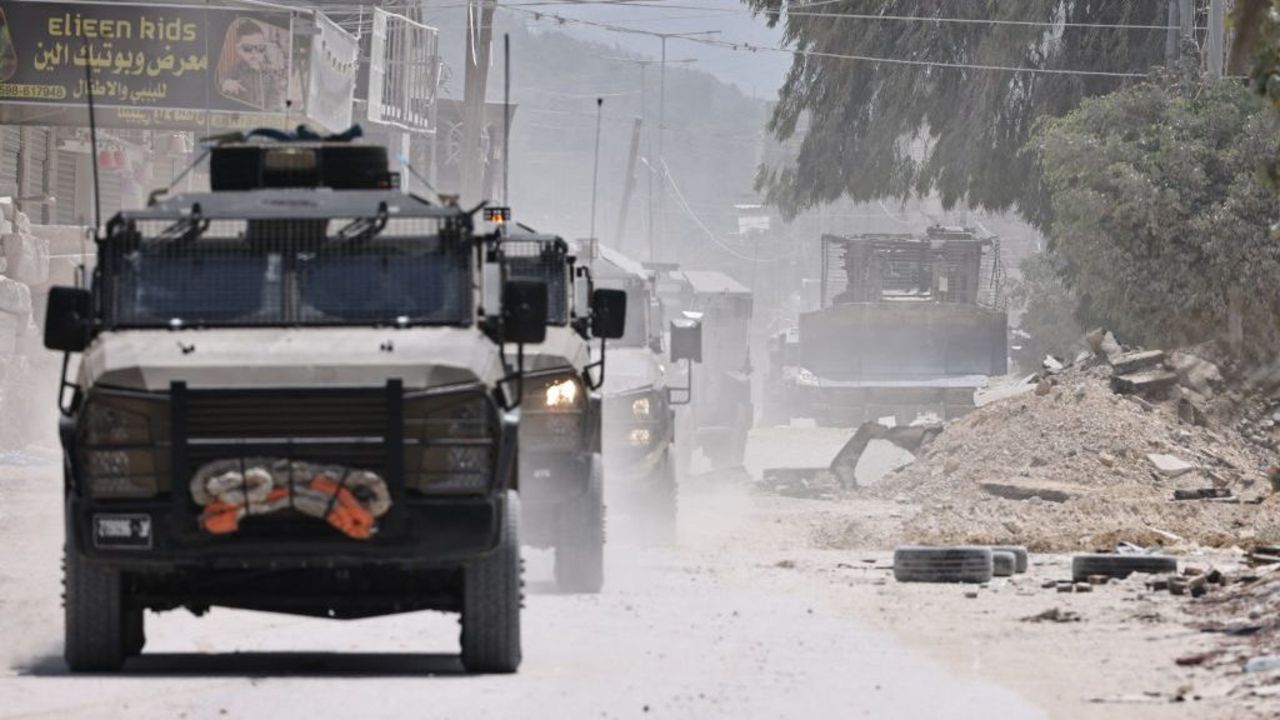 TOPSHOT - Israeli forces' armoured vehicles enter the Nur Shams camp for Palestinian refugees, east of Tulkarm in the occupied West Bank, on July 1, 2024. The Palestinian health ministry said an Israeli strike on June 30 left a man killed and five others wounded in the camp, the latest reported raid in months of soaring violence. (Photo by Zain JAAFAR / AFP)