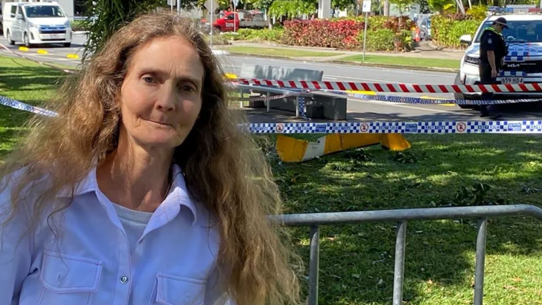 Witness Veronica Knight stands next to one of the rotors of the helicopter that landed a short distance from the hotel.