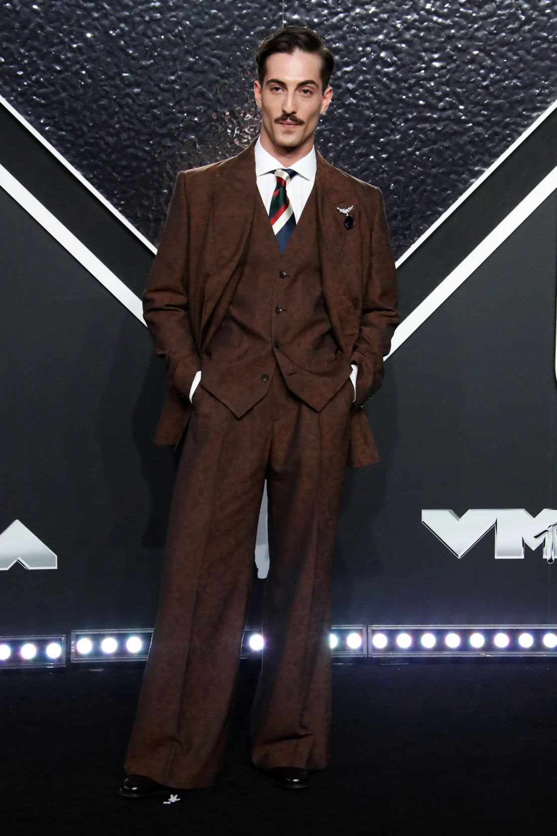 Damiano David de Måneskin wore a three-piece jacquard suit, with long trousers and shorts, by Italian brand Etro. Image credit: Matt Baron/BEI/Shutterstock.