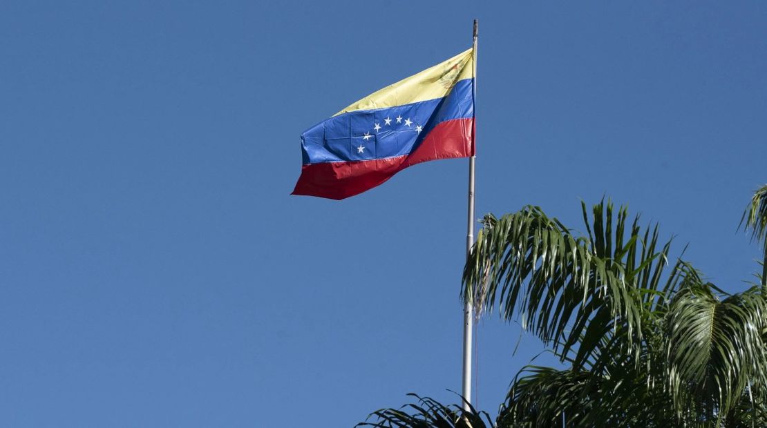 The flag of Venezuela flies over the National Assembly building in Caracas, Venezuela. Credit: Carlos Becerra/Bloomberg/Getty Images