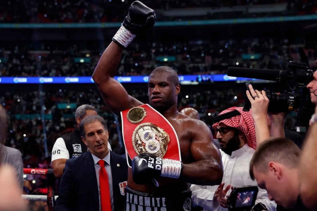 Dubois celebrates after retaining his International Boxing Federation (IBF) heavyweight title by winning his fight against Joshua. Credit: Andrew Carridge/Action Images/Reuters