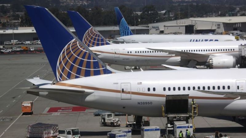 Two passengers were taken to hospital with injuries on a United flight after pilots responded to a crash call.