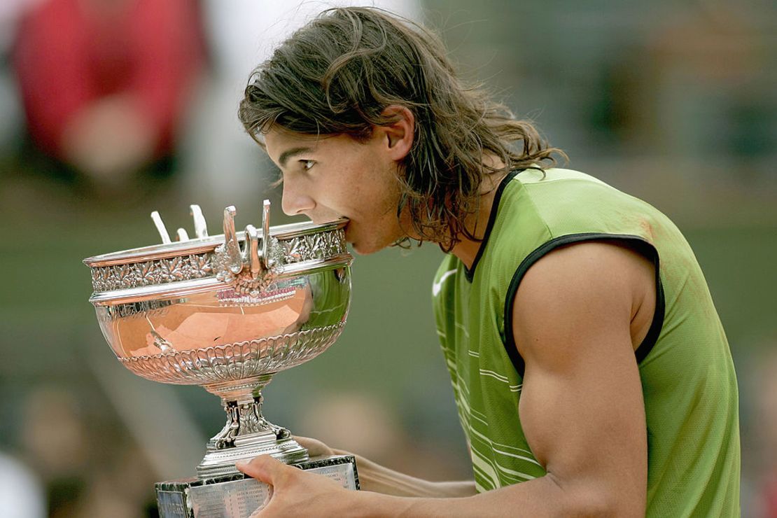 Rafael Nadal of Spain poses with the winners' trophy after defeating Mariano Puerta of Argentina 3-1 during the men's final on day fourteen of the French Open at Roland Garros on June 5, 2005 in Paris, France.