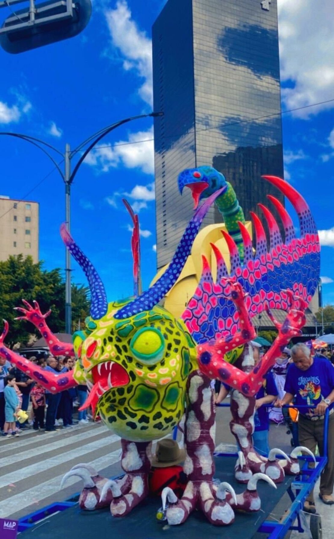 A cardboard alebrije made by the family of Pedro Linares, creator of alebrijes, parades along Paseo de la Reforma in CDMX on October 19, 2024.