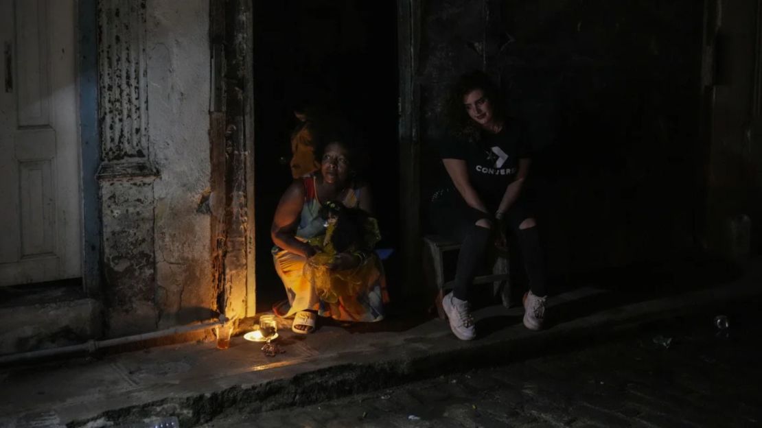 Residents pass time during a blackout following the failure of a major power plant in Havana, Cuba, on Saturday, October 19, 2024.