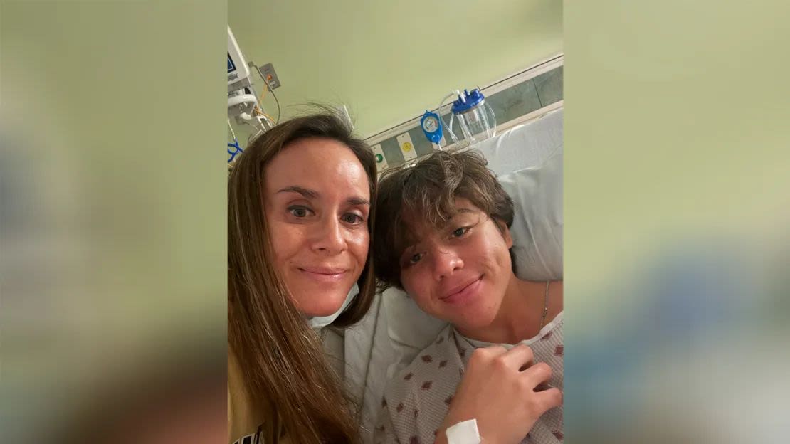 Kahiau Kawai with his mother, Kelehua Kawai, in the hospital after being rescued.