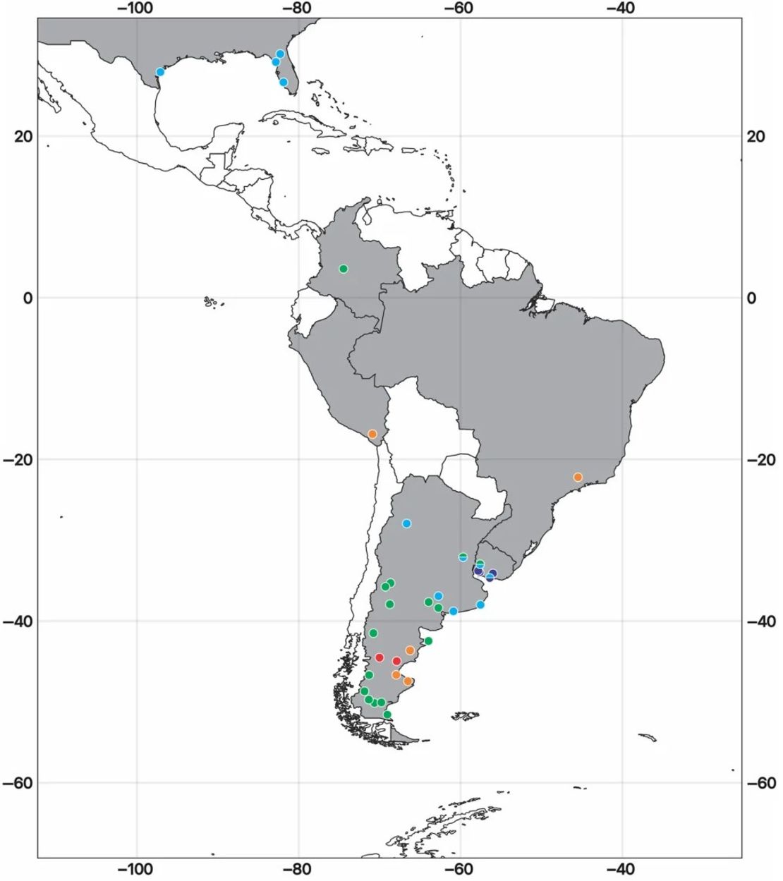 Un mapa muestra los países (en gris) donde se han encontrado fósiles de aves del terror. Los puntos de color indican la ubicación de los yacimientos de fósiles.