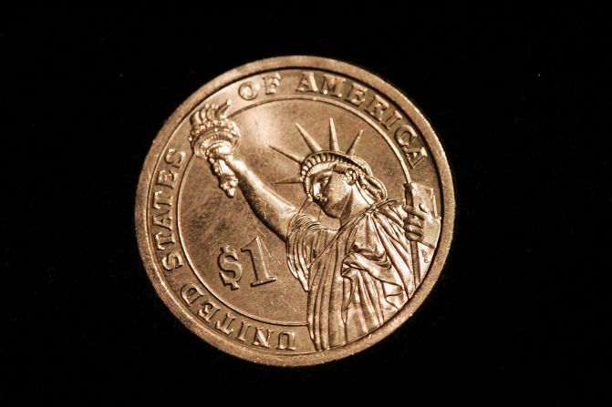 2007: Una moneda de un dólar de la serie presidencial. El reverso de la moneda muestra a la Estatua de la Libertad.