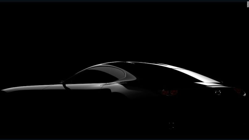 Mazda Sports Car Concept – Este adelanto del prototipo de auto deportivo de Mazda nos deja ver qué es lo que vendrá. El auto será revelado por completo en Tokio, y ya hay mucha especulación respecto a que presagiará un Mazda RX de motor rotativo... el tan esperado hermano mayor del MX-5.