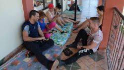 Cubans rest at a Methodist church sheltering 35 Cuban refugees in Liberia, Guanacaste, Costa Rica, on December 29, 2015. Costa Rica on Tuesday warned it should not be seen as an "open bridge" to America after striking a deal to start shipping out stranded Cuban migrants to other Central American countries. AFP PHOTO/Carlos GONZALEZ / AFP / CARLOS GONZALEZ