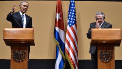 US President Barack Obama (L) and Cuban President Raul Castro give a joint press conference at the Revolution Palace in Havana on March 21, 2016. Cuba's Communist President Raul Castro on Monday stood next to Barack Obama and hailed his opposition to a long-standing economic "blockade," but said it would need to end before ties are fully normalized.   AFP PHOTO/Nicholas KAMM / AFP / NICHOLAS KAMM