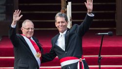 Peru's President Pedro Pablo Kuczynski (L) and his Economy Minister Alfredo Thorne wave at the Government Palace in Lima on July 28, 2016. 

Kuczynski, who was sworn in as president of Peru, says he will hit the ground running after a long career as a Wall Street banker that gave him the moniker "El Gringo". Kuczynski, 77, defeated Keiko Fujimori, the daughter of a jailed former president, in a hard-fought presidential election last month that was decided by a razor-thin margin. / AFP / ERNESTO BENAVIDES