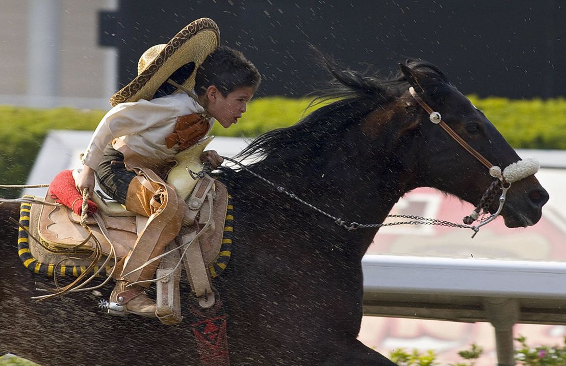 CNNE 355401 - a mexican charro boy rides his horse at