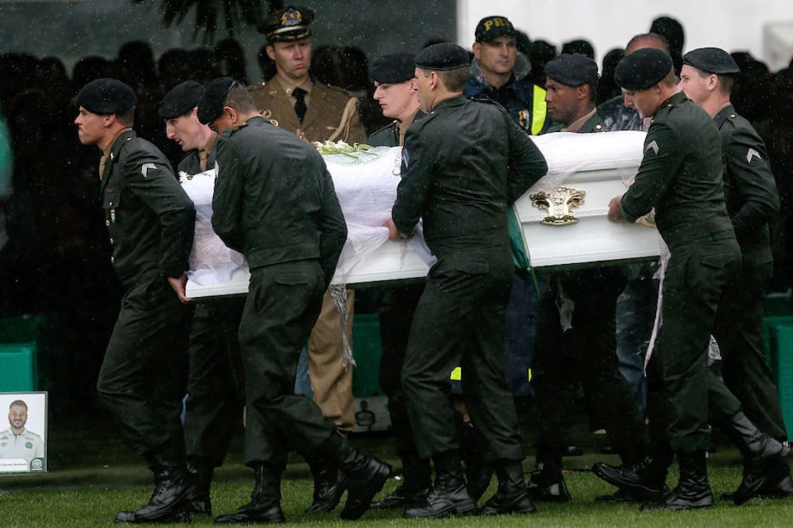 CHAPECO, BRAZIL - DECEMBER 03:  Air Force troops carry coffin of one of the victims of the plane crash in Colombia at the Arena Conda stadium on December 03, 2016 in Chapeco, Brazil. Players of the Chapecoense soccer team were among the 77 people on board the doomed flight that crashed into mountains in northwestern Colombia. Officials said just six people were thought to have survived, including three of the players. Chapecoense had risen from obscurity to make it to the Copa Sudamericana finals against Atletico Nacional of Colombia.  (Photo by Buda Mendes/Getty Images)