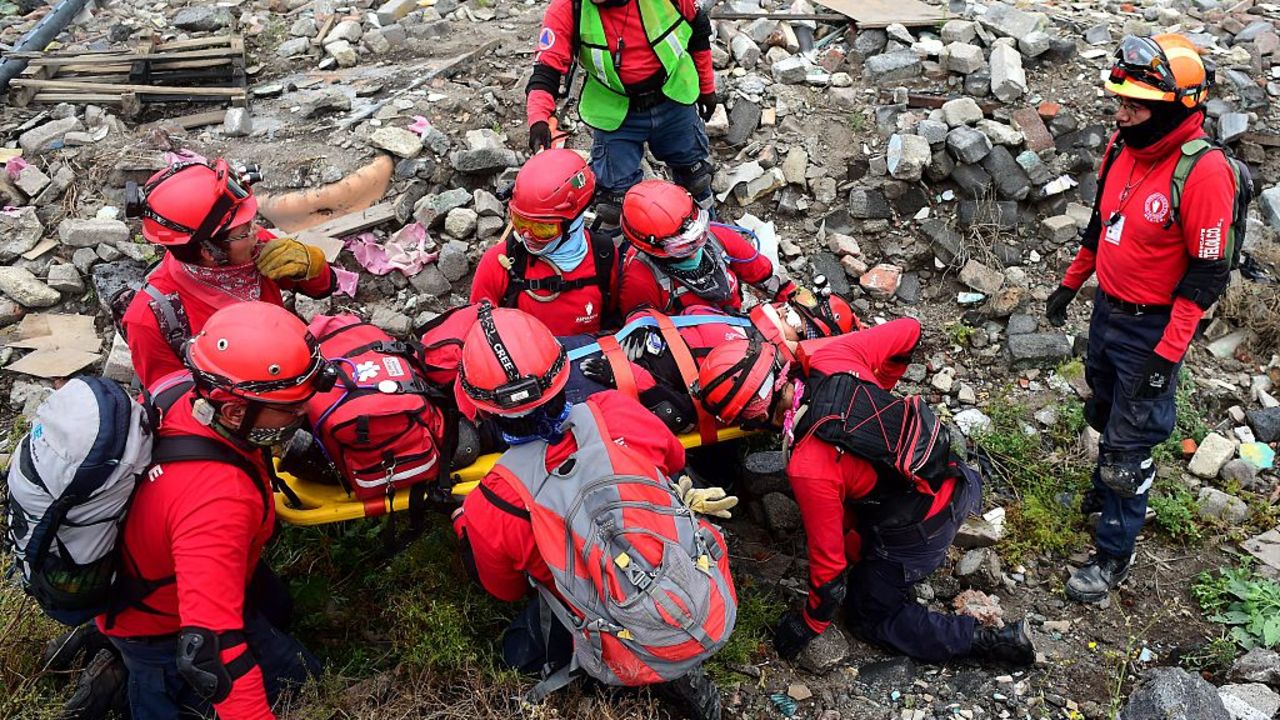 Members of the "Topos" (moles) Mexican search and rescue group take part in a drill in Mexico City, on September 13, 2015. Next September 19 commemorates the 30th anniversary of the Mexico City's earthquake that left thousands dead. AFP PHOTO/RONALDO SCHEMIDT