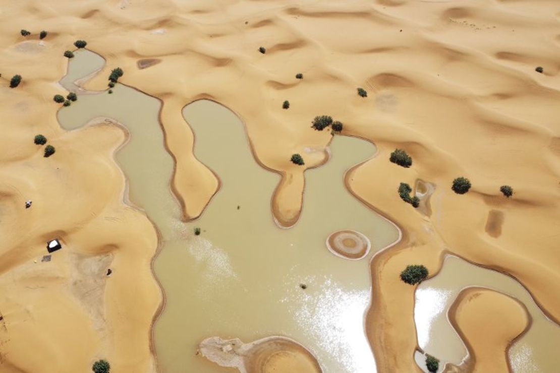 View of lakes formed by heavy rains amid sand dunes in the desert city of Merzouga near Rachidia, southeastern Morocco on October 2, 2024.