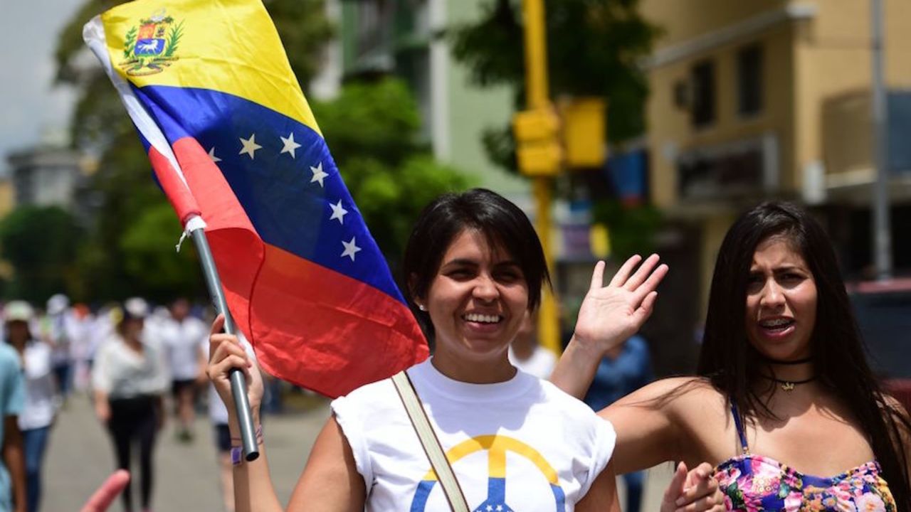 Opposition activists march towards the Catholic Church's episcopal seats nationwide, in Caracas, on April 22, 2017.
Venezuelans gathered Saturday for "silent marches" against President Nicolas Maduro, a test of his government's tolerance for peaceful protests after three weeks of violent unrest that has left 20 people dead. / AFP PHOTO / RONALDO SCHEMIDT