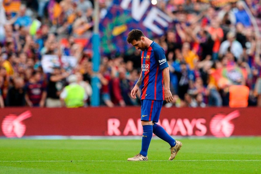 Barcelona's Argentinian forward Lionel Messi looks downwards after Eibar's goal during the Spanish league football match FC Barcelona vs SD Eibar at the Camp Nou stadium in Barcelona on May 21, 2017. / AFP PHOTO / Josep LAGO