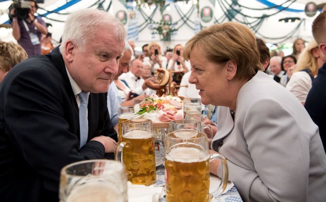 German Chancellor Angela Merkel (R) and premier of the German state of Bavaria, Horst Seehofer sit in a beer tent during a joint campaigning event of the Christian Democratic Union (CDU) and the Christion Social Union (CSU) in Munich, southern Germany, on May 27, 2017.  / AFP PHOTO / dpa / Sven Hoppe / Germany OUT